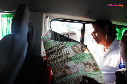 A Thai man was reading the newspaper