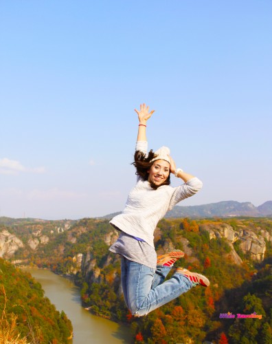 Jumping at the top of the mountain in Tianzhu Wonderland Scenic Area in Xinchang